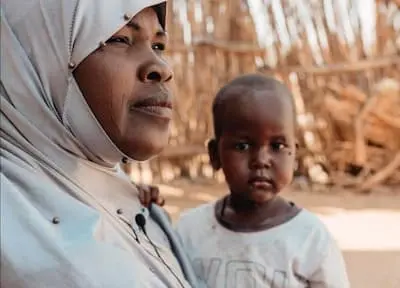 Woman with child looking into distance