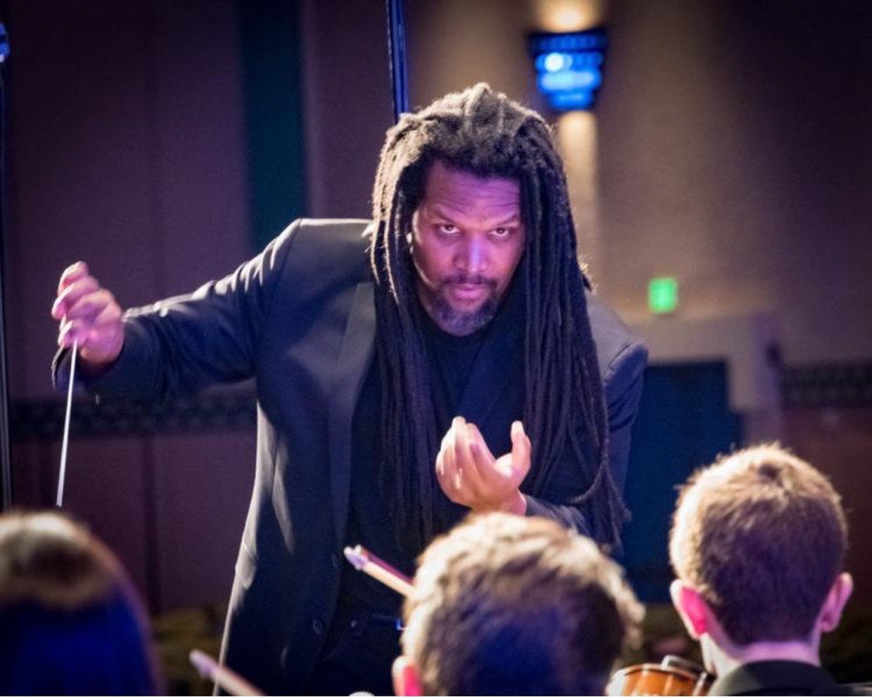 Music instructor teaching his students