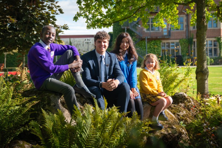 Students from Queen Ethelburga's, York, on the school grounds.