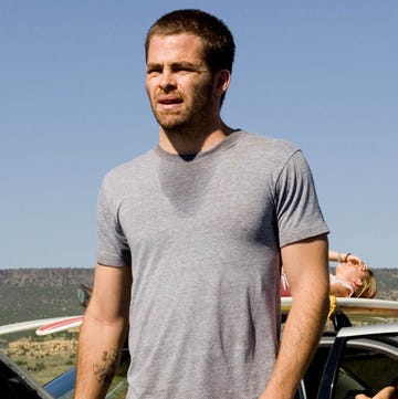 Chris Pine, Carriers chris pine holding a gun next to a broken down car on a rural road in carriers