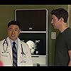 John Krasinski and Randall Park in The Hollars (2016)