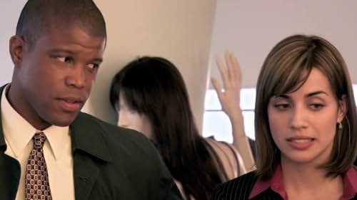 Sharif Atkins and Natalie Morales in White Collar (2009)