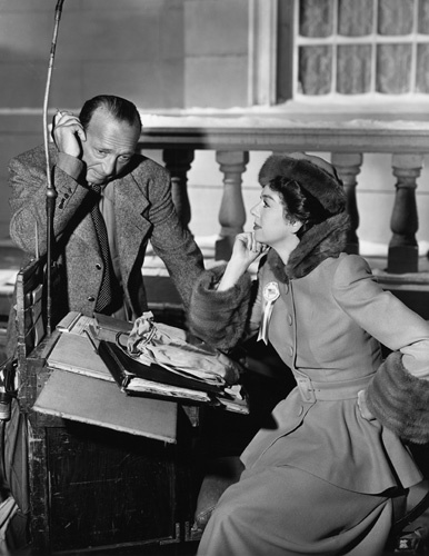 Rosalind Russell and Director Michael Curtiz on the set of "Roughly Speaking"