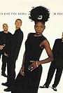 Paul Heard, Mike Pickering, Heather Small, Shovell, and M People in M People: Search for the Hero (1995)