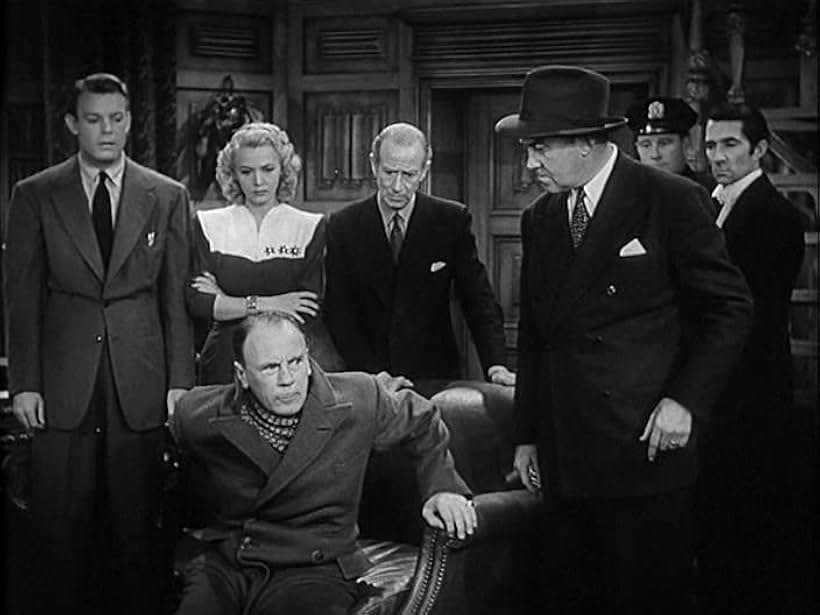 Trevor Bardette, Eddy Chandler, Carole Landis, Donald MacBride, Dennis O'Keefe, H.B. Warner, and Roland Young in Topper Returns (1941)