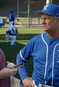 Eric Stonestreet and George Brett in Modern Family (2009)