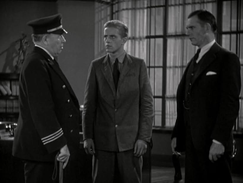 Phillips Holmes, Walter Huston, and DeWitt Jennings in The Criminal Code (1931)