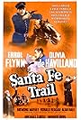 Olivia de Havilland, Errol Flynn, Ronald Reagan, and Raymond Massey in La piste de Santa Fé (1940)