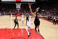 NBA 2026: Houston Rockets Edge Phoenix Suns 100-97 For Narrow Win | Photo: AP/David J. Phillip : Phoenix Suns' Devin Booker (1) goes up for a shot as Houston Rockets' Steven Adams (12) defends during the second half of an NBA basketball game in Houston.