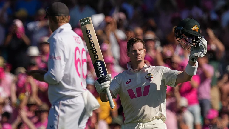 Steve Smith raises his bat after reaching his hundred in the 5th Ashes Test. - AP/Mark Baker