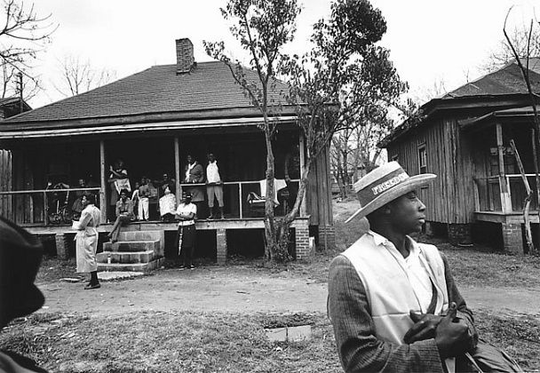 Image may contain Human Person Nature Shelter Outdoors Building Countryside Rural Clothing Apparel Hat and Yard