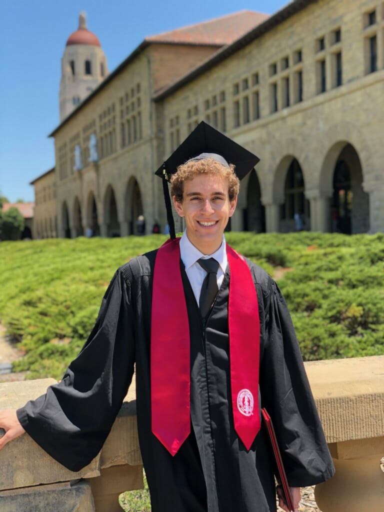 Chess grandmaster Daniel Naroditsky in graduation attire.