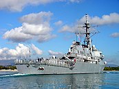 Flight I ship USS Fitzgerald with Tactical Towed Array Sonar (TACTAS) in the center of the fantail, Harpoon missile launchers, distinctive stacks, and no helicopter hangars