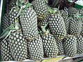 A basket of pineapples displayed in a Singapore supermarket.