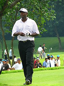 Vijay Singh walking.