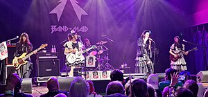 Band-Maid performing at House of Blues in Dallas, October 2022 (L–R: Misa, Miku Kobato, Akane Hirose, Saiki Atsumi, Kanami Tōno)