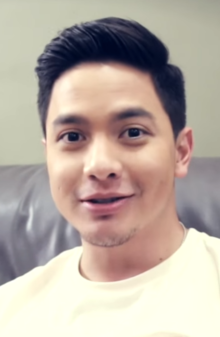 A closeup of Alden Richards smiling at the