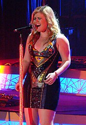 A woman singing a high note.