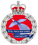 The emblem of the Royal Papua New Guinea Constabulary featuring featuring the Crown