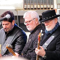 Members of YU Grupa performing live in Belgrade in 2018, from left to right: Petar, Dragi and Žika Jelić