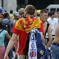 Fan in Cologne, carrying GDR flag and scarf of a British soccer club