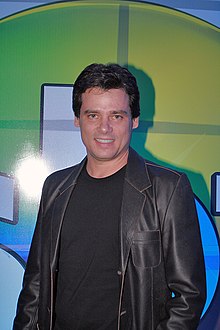 Smiling young man, dressed casually in black