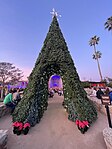 Decorative walk-through Christmas tree at Mission San Juan Capistrano festival, Southern California, December 2023