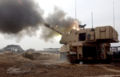 M109A6 Paladin from 1st Cavalry Division, fires a round from Camp Taji, Iraq, April 2004.