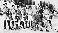 Black and white photo of Torriani reciting the Olympic oath at the start of the 1948 Winter Olympic Games in St. Moritz