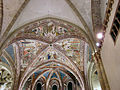 A simple ribbed arch decorated with fresco in Italy.