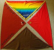 Four Scout scarves (clockwise from top) the 21st World Scout Jamboree scarf, a Gang Show scarf from Cumberland Gang Show, the troop and group scarf from 1st Cherrybrook Scout Group, and the national scarf for Australia