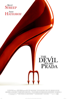 A single redhigh heel shoe, the stiletto ending in a devil's pitchfork.