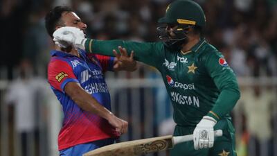 Pakistan's Asif Ali, right, and Afghanistan's Fareed Ahmad clashed at Sharjah Cricket Stadium on Wednesday. AFP