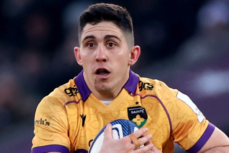 Northampton Saints' French fly-half Anthony Belleau running with the rugby ball during a match.