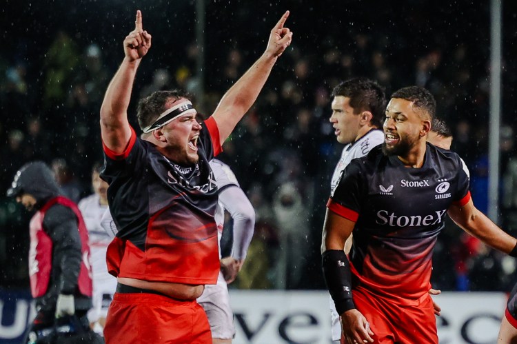 Saracens rugby players celebrate their victory over Toulouse at the European Rugby Champions Cup final.