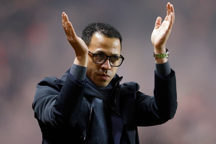Chelsea manager Liam Rosenior applauds fans.
