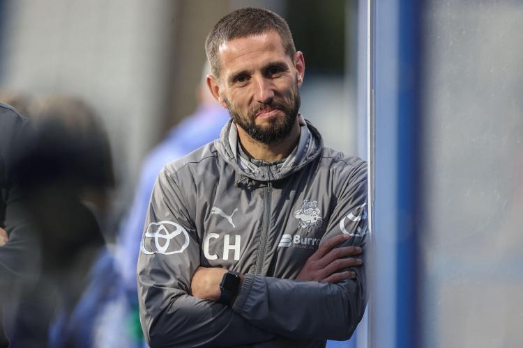Conor Hourihane of Barnsley with his arms crossed during the Bristol Street Motors Trophy match.