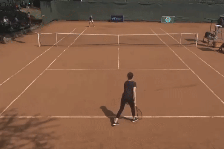 Two tennis players on a clay court.